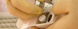 Scientists at the National Microbiology Lab in Winnipeg prepare an experimental Ebola vaccine for shipment to the World Health Organization